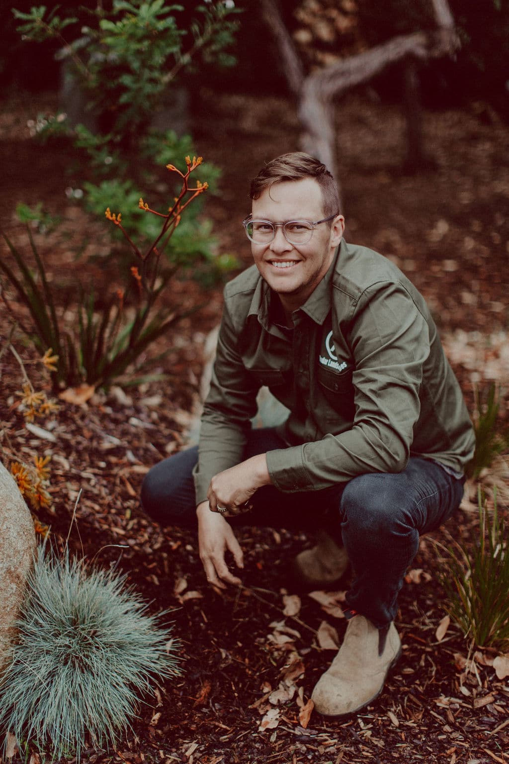 Tim Looker Photo of Radar Landscapes Tim Looker smiling and kneeling in a garden